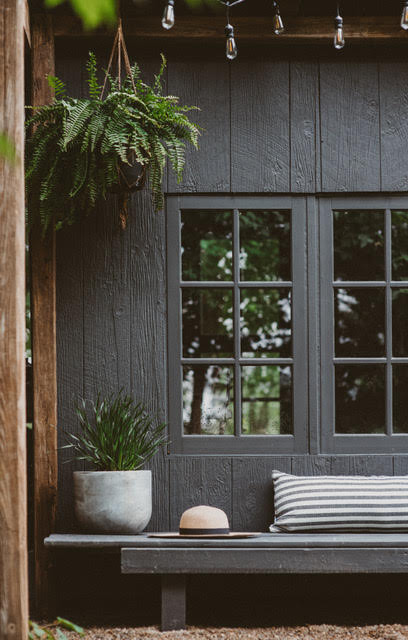 Black stained shed used for photograpy, and potting.