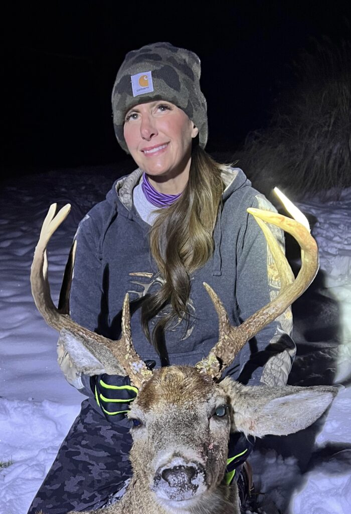 Hunter, Laura bee pictured with her buck, she named, Moss Man.